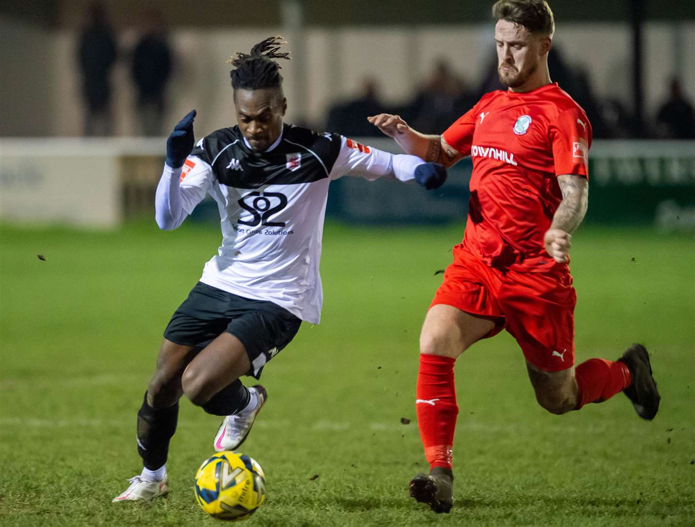Faversham’s Toby Ajala tries to get by an away player. Picture: Ian Scammell