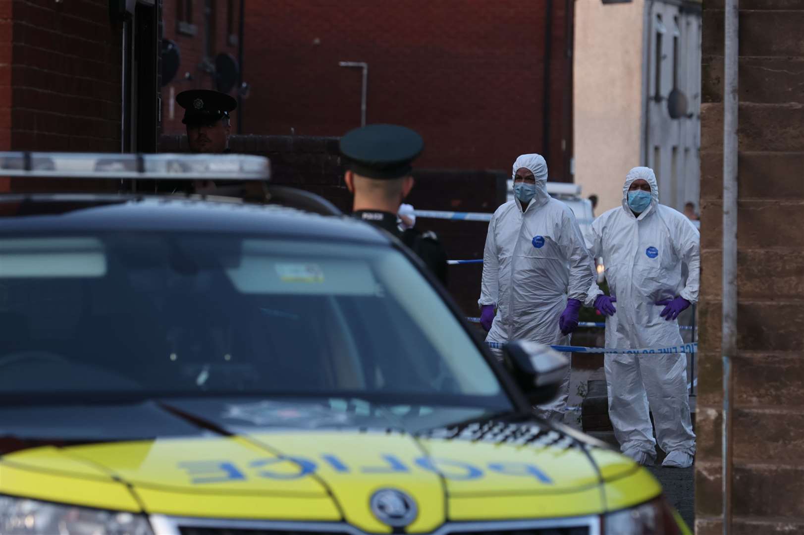 Police forensic officers at a property in James Street, Ballymena, on Sunday night (Liam McBurney/PA)