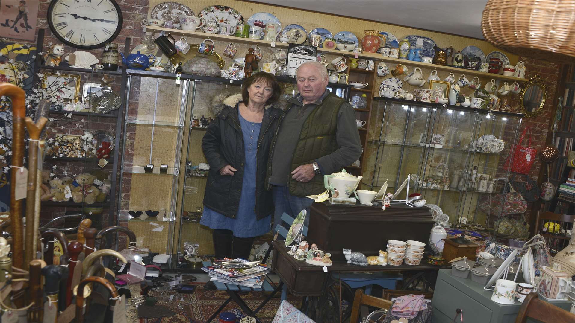 Wendy Pursglove and Chris Pursglove in front of the cabinets that were emptied