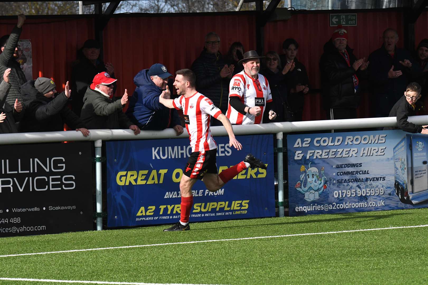 Danny Leonard high-fives the fans after scoring Sheppey’s third against Beckenham on Saturday. Picture: Marc Richards