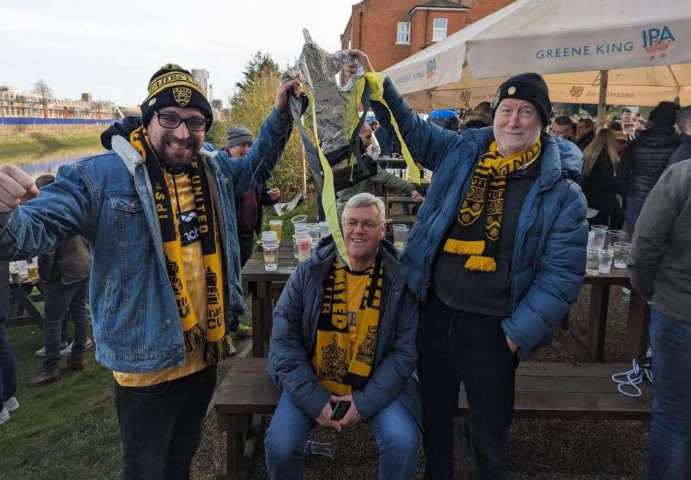 Life-long Maidstone United supporter Callum Glazier has always attended matches with his dad Graham (middle) and godfather Bob Piggot. Photo credit: Callum Glazier