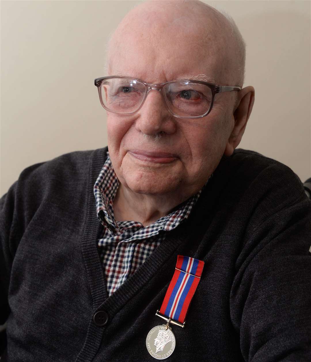 96-year old Albert Gear with his medal