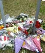 Floral tributes placed near the scene of the crash