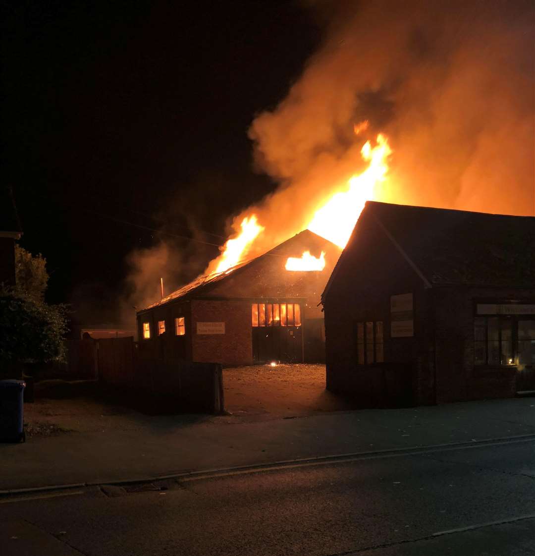 Flames burst through the roof of FJ Williams joinery in London Road, Teynham. Picture: Paul Mercer (5309079)