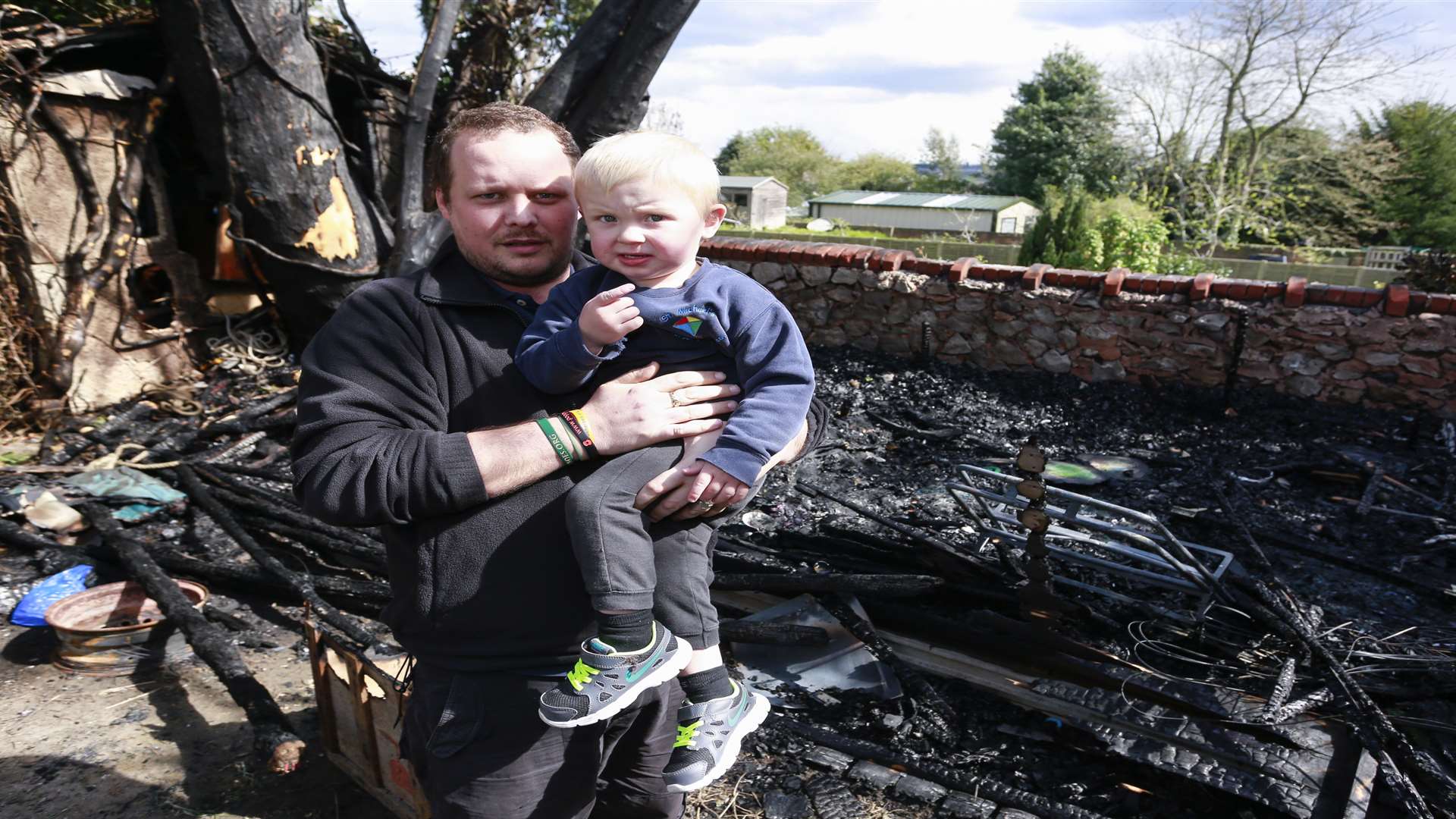 Deputy manager Daniel Gibbons and little Freddie Grantham survey the damage. Picture: Martin Apps