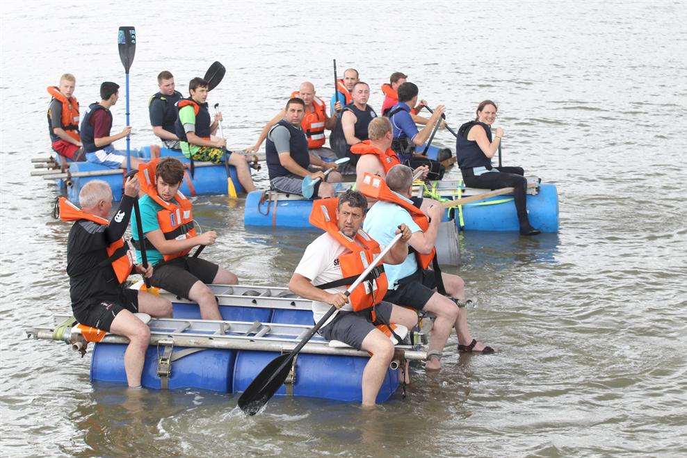 The teams at the start of The Raft Race at the Summer Fair at Greenhithe river front.