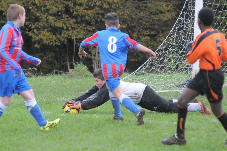 Goalmouth action as Lordswood Youth Tigers and Woodpecker HI contest the points in Under-13 Division 2. Picture: Steve Crispe