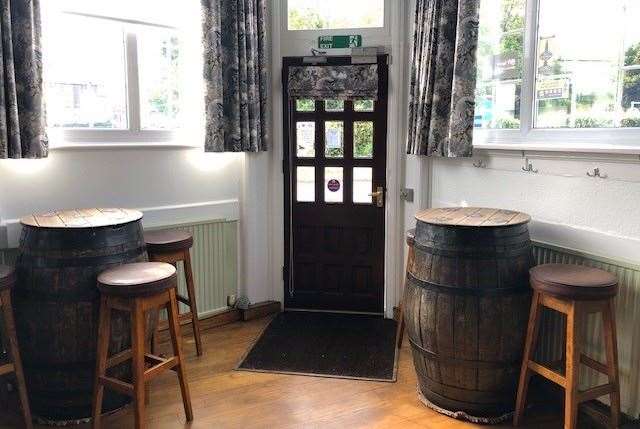 This is the front door viewed from the main bar. The large barrel tables were placed on carpet circles so they can be easily re-positioned on the smooth wooden floor