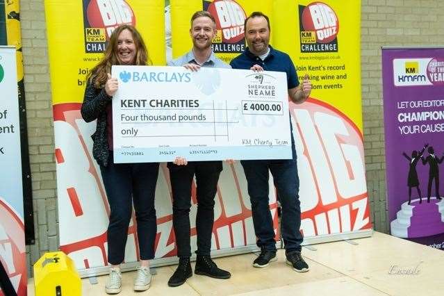 Joanna Wyndham of Specsavers, Kentish Gazette editor Joe Walker and Barclays manager Richard Cope with a cheque for £4,000 raised at the Canterbury heat of the KM Big Charity Quiz (9322294)