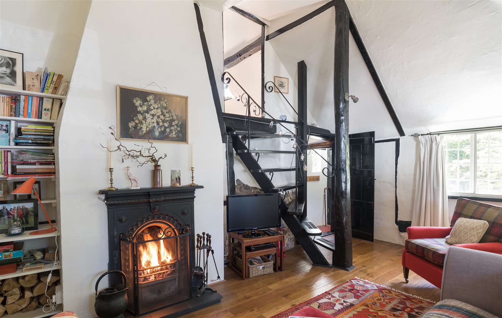 There's a quirky staircase and polished floorboards at Dormer Cottage