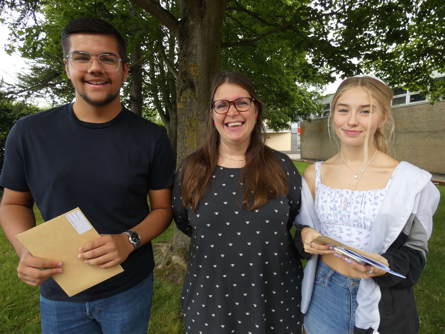 Head of school Susie Burden with Rhys Medwyn and Kiera Hotham as they collected their GCSE results at Fulston Manor School, Sittingbourne