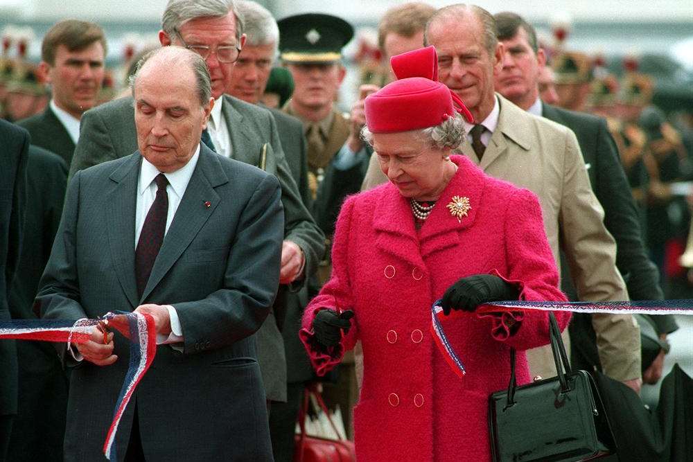 Queen Elizabeth II and France's President Mitterand cut the ribbon to officially open the Channel tunnel in 1994. Picture: PA/Tim Ockenden
