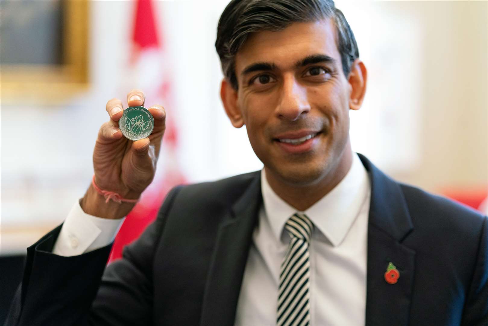 Rishi Sunak with the new £5 coin unveiled today. Picture: HM Treasury.