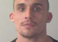 Lukasz Szymczak, 28, kicked, punched and tipped a wheelie bin onto the man during an assault