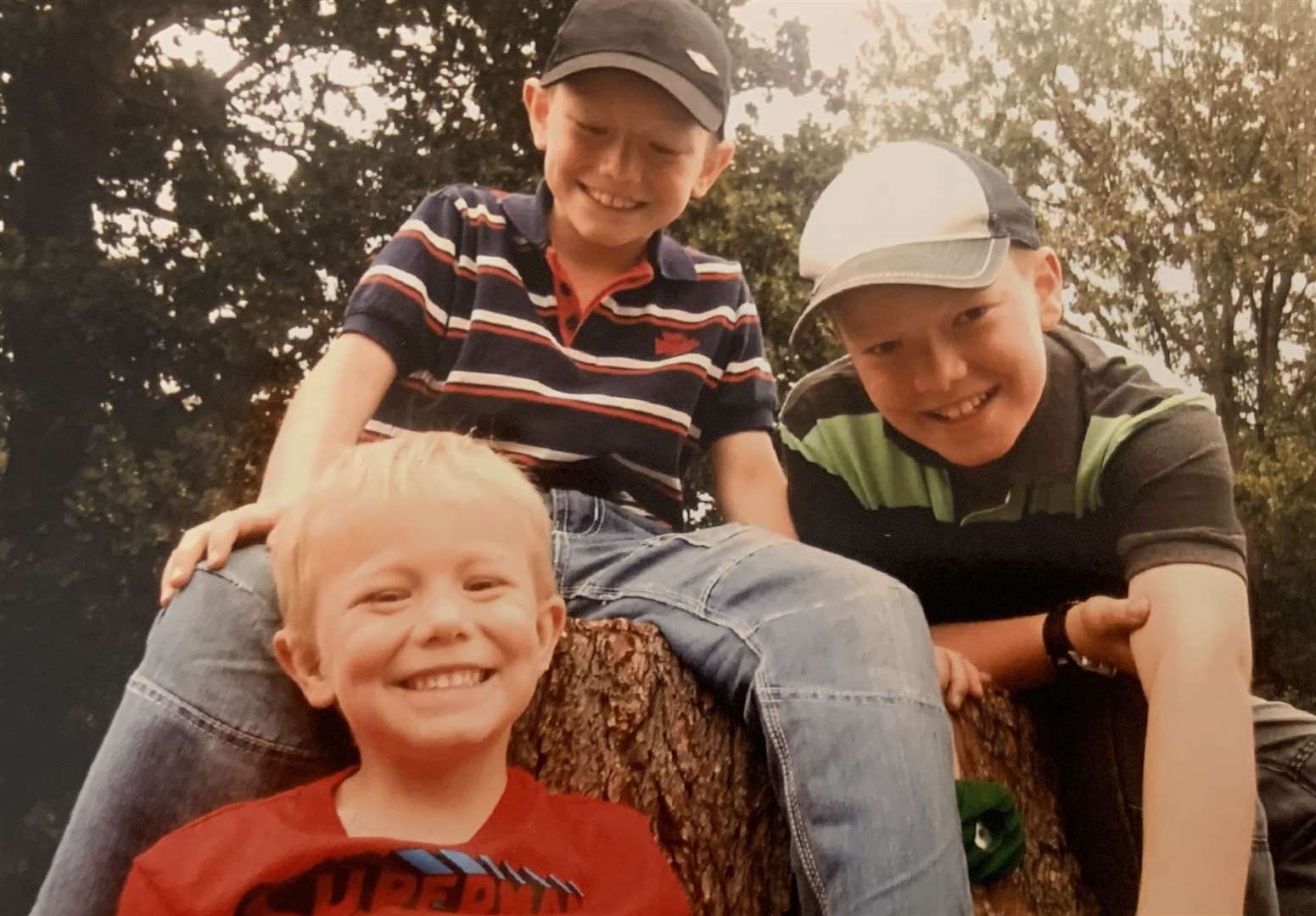 Matthew Mackell with his two brothers Christopher and Daniel. Picture: Michael Bond