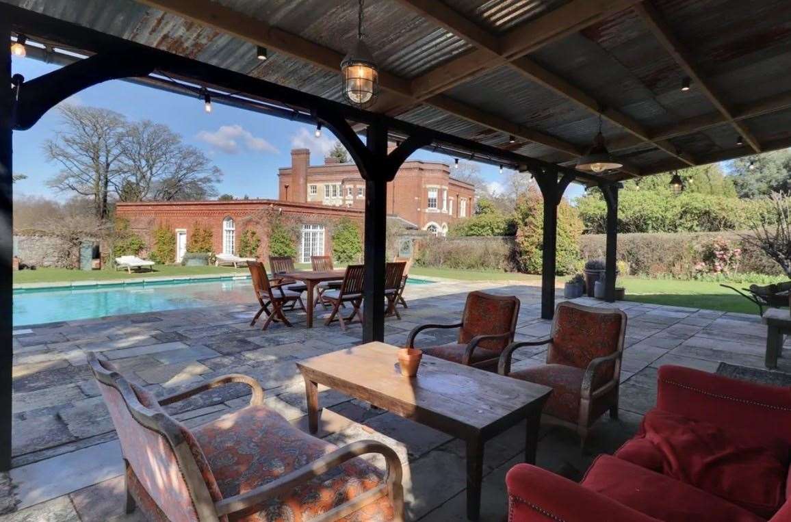 The outdoor seating area next to the pool. Picture: Zoopla / Savills