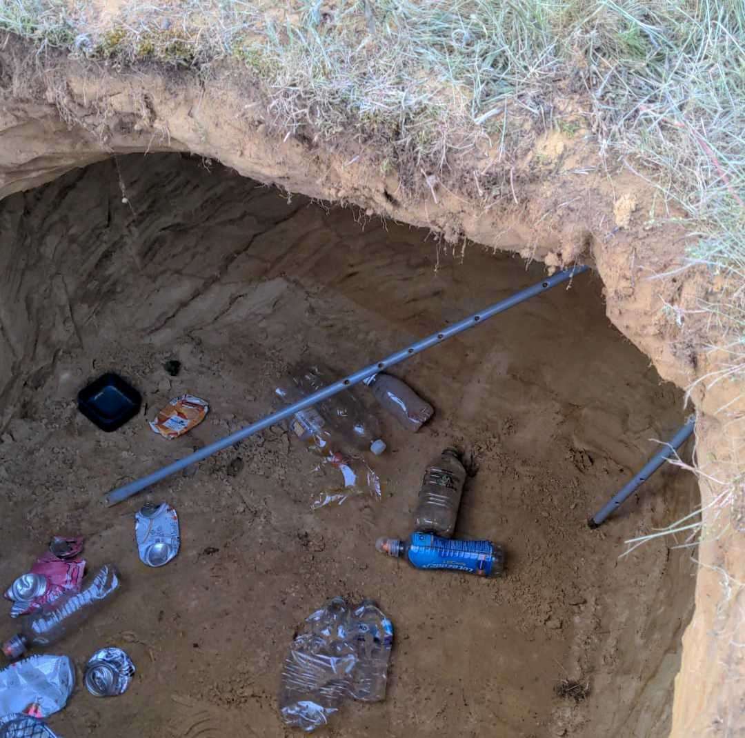 Empty bottles, cans and a disposable barbecue are littered at the bottom. Picture: Dylan Rowe