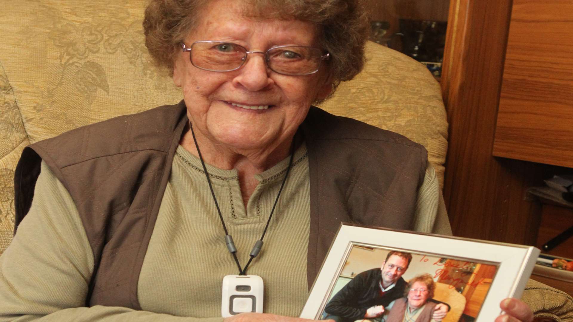 Pensioner, Margaret Crabb with a signed photograph of TV star Matt Allwright