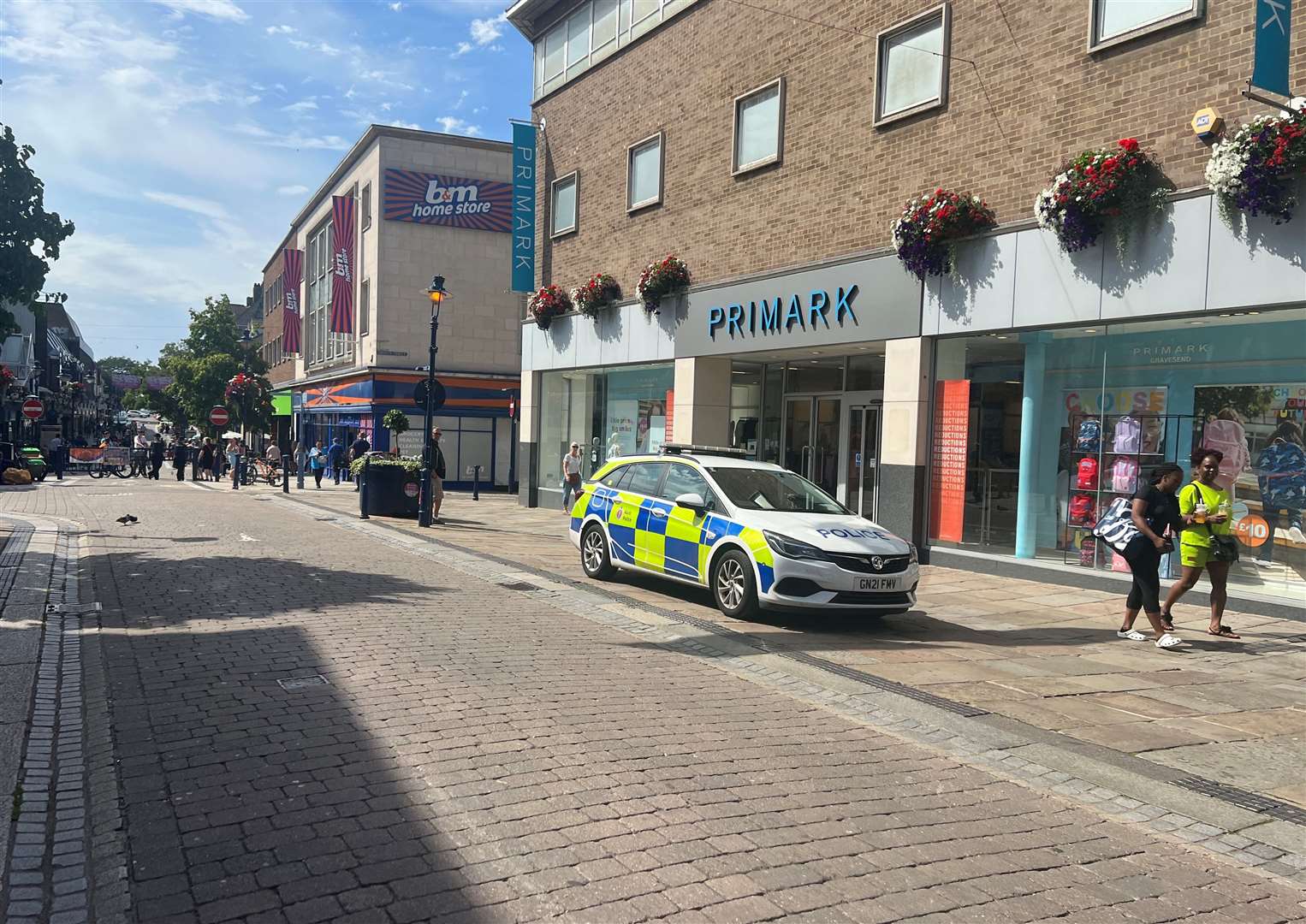 Police in New Road, Gravesend, outside Primark