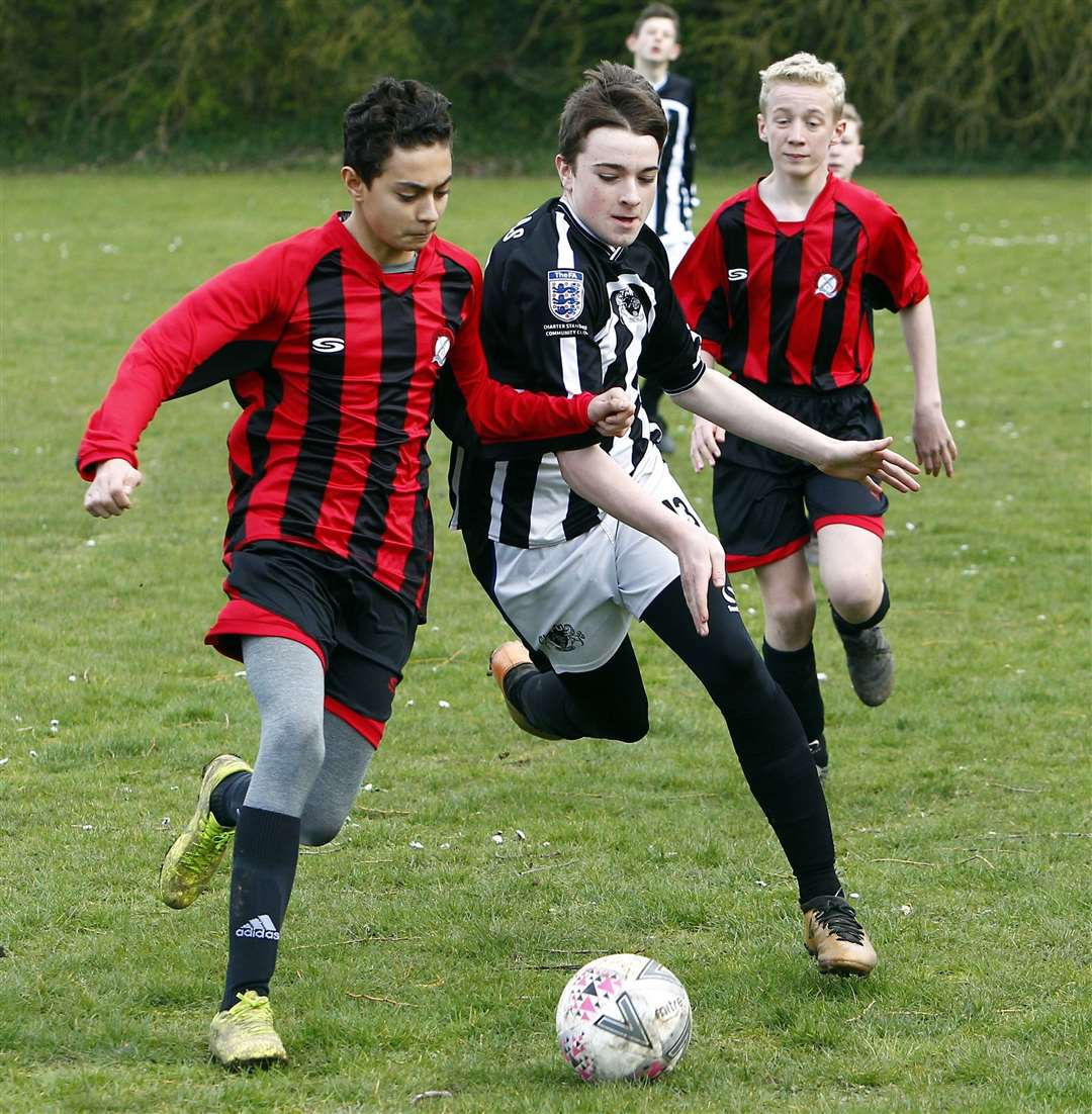 Meopham Colts (left) and Milton & Fulston Zebras go head-to-head in Under-14 Division 2 Picture: Sean Aidan FM31646650