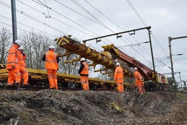Network Rail staff will remove an overhanging tree from the railway near Wye. Stock image