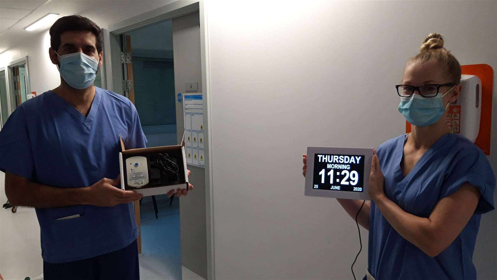 Hospital staff with one of the Aerogens and a dementia clock