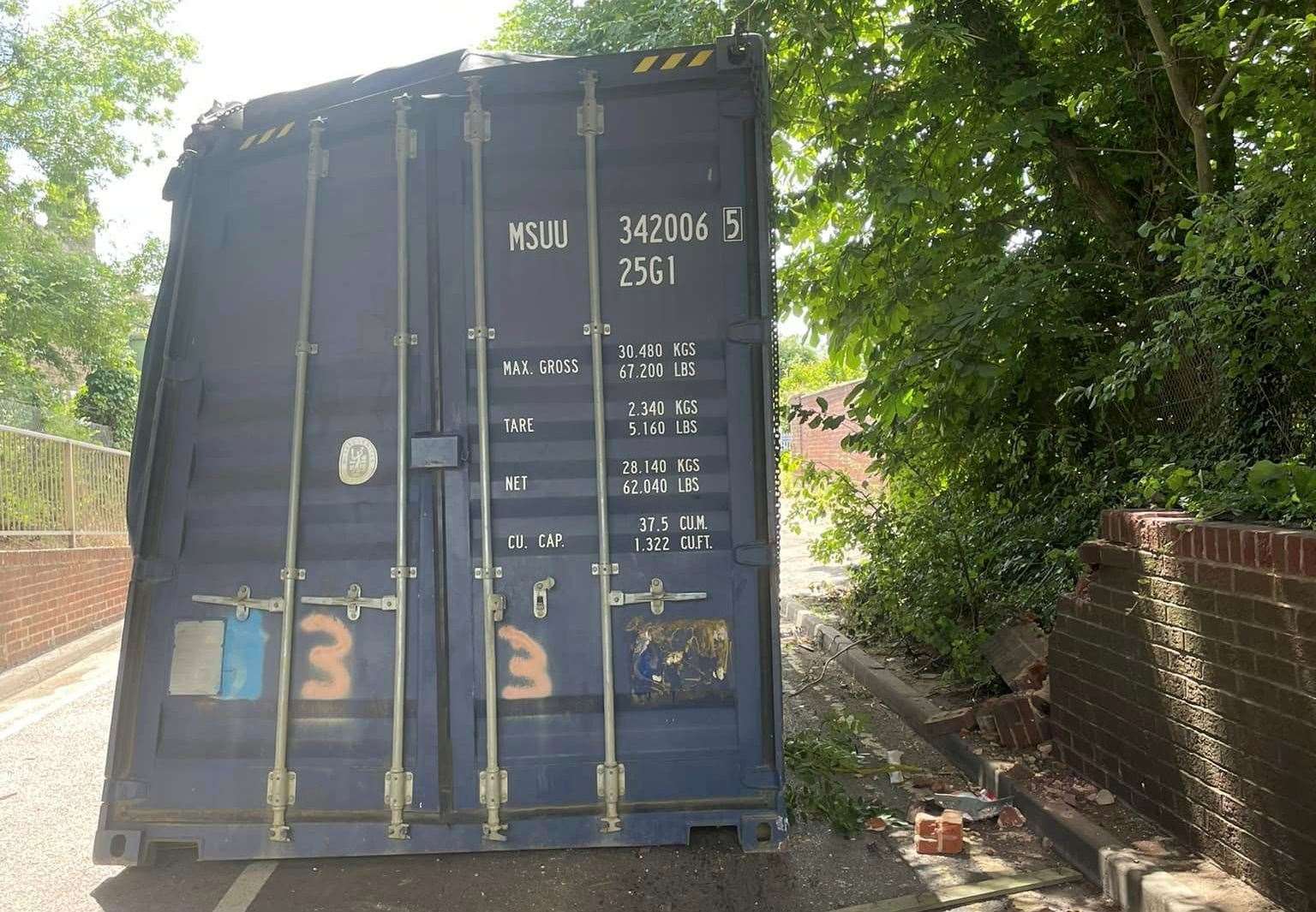 A container was knocked off the back of a lorry after it hit a railway bridge in Pattenden Lane in Marden. Picture: Marden Parish Council