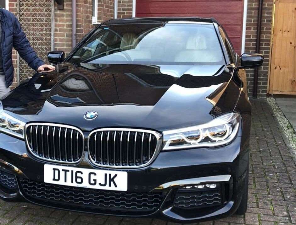 The black BMW 7 Series was stolen on Friday, October 14