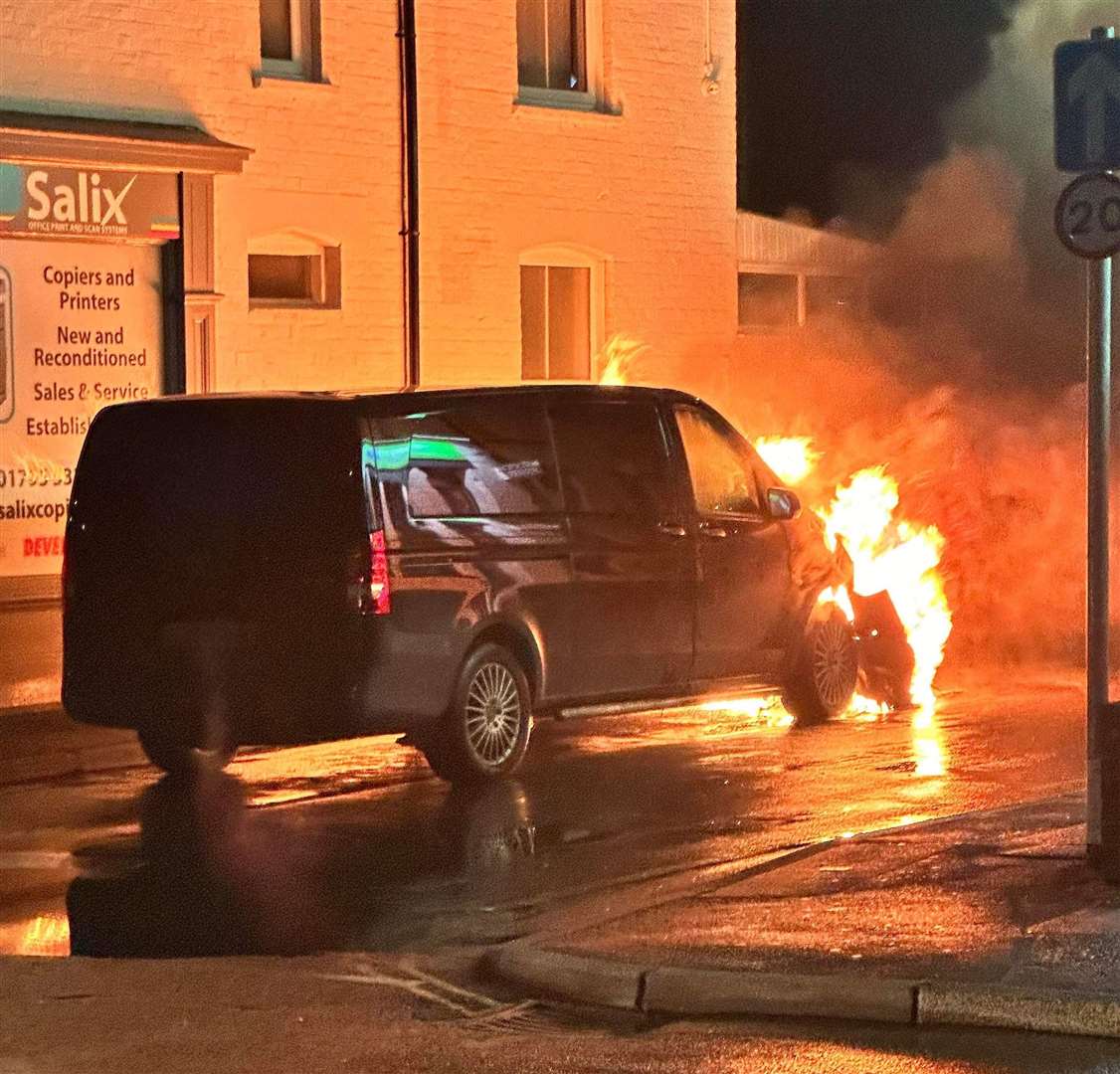 Flames pour from the front of the Mercedes van. Picture: Ben Fisher