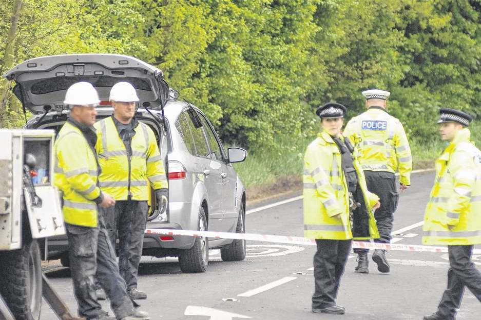 Rescuers at the scene after car hits telegraph pole