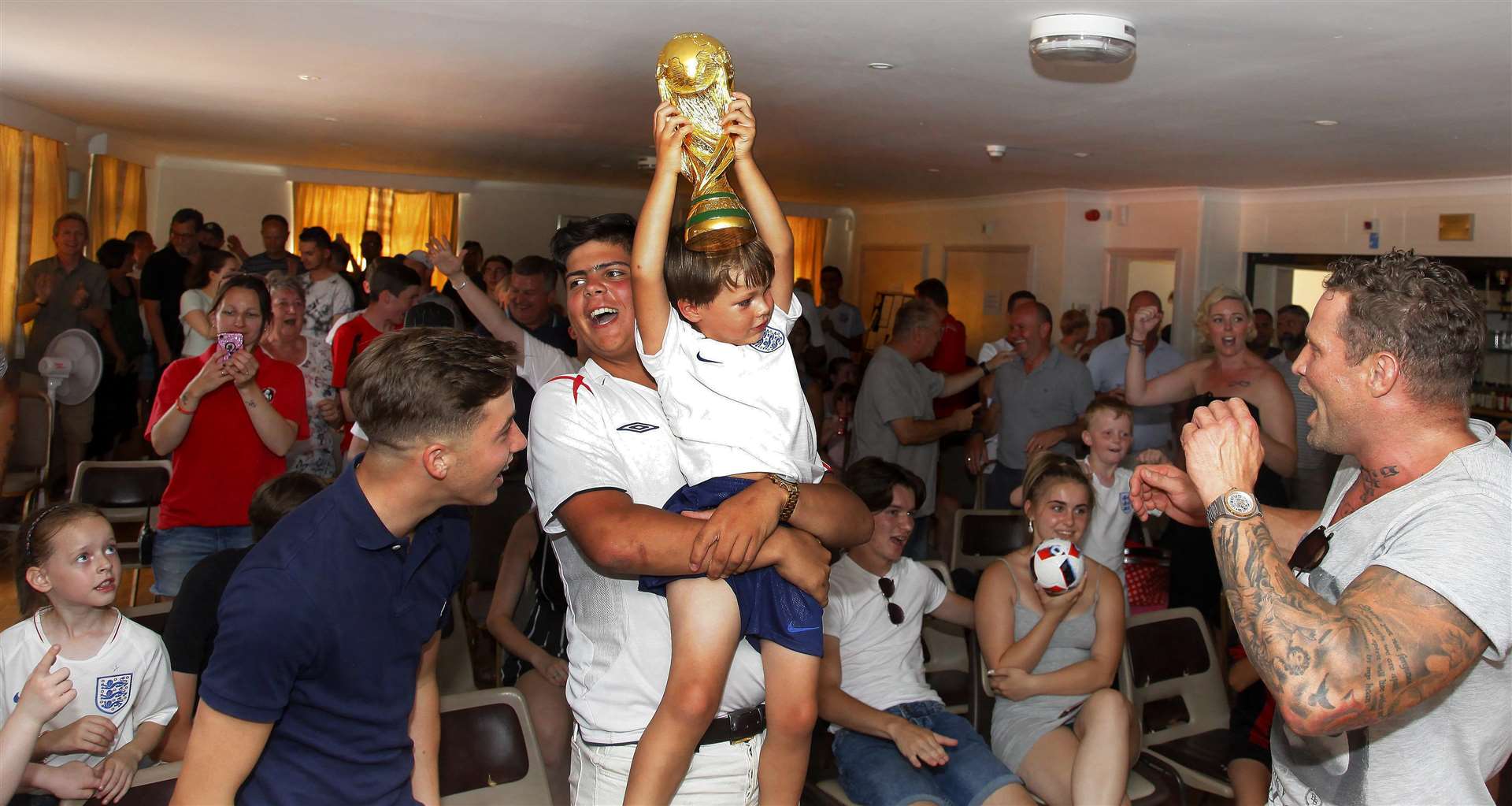 World Cup celebrations at the Ditten Community Centre. Logan Cribben 4 with the World Cup. Picture: Sean Aidan