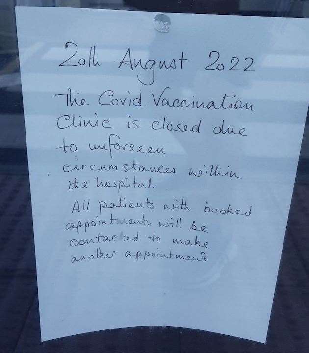 A sign has been placed on the door informing patients