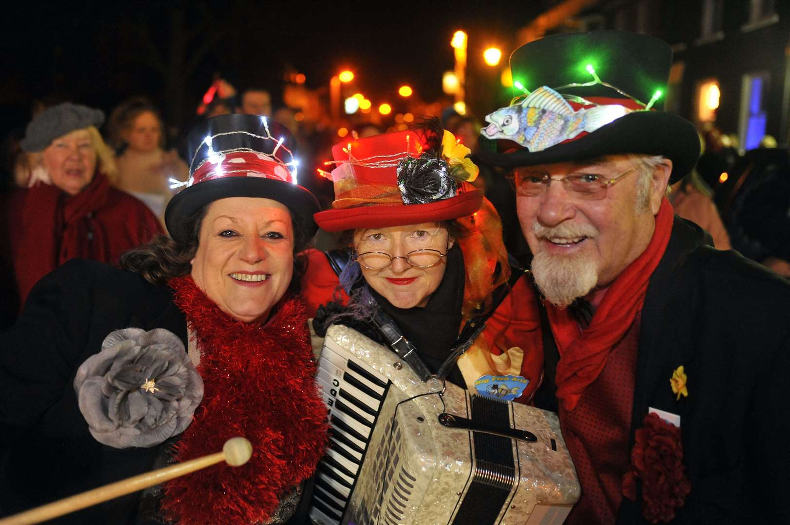 Sue Percival, Chris Reed and Jim Enright at the torchlight parade, carol service and fireworks in Queenborough