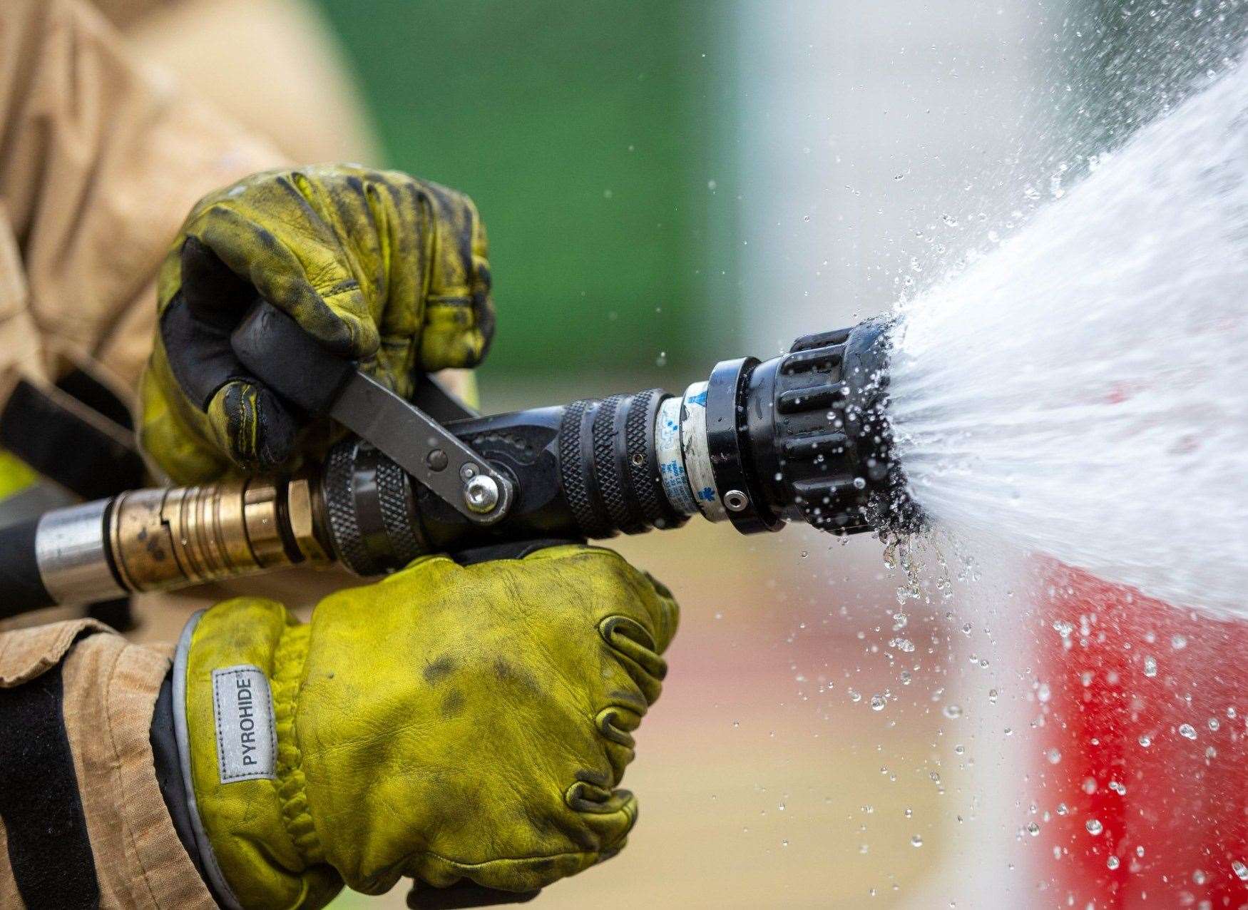 Kent Fire and Rescue crew using a waterjet. Stock photo