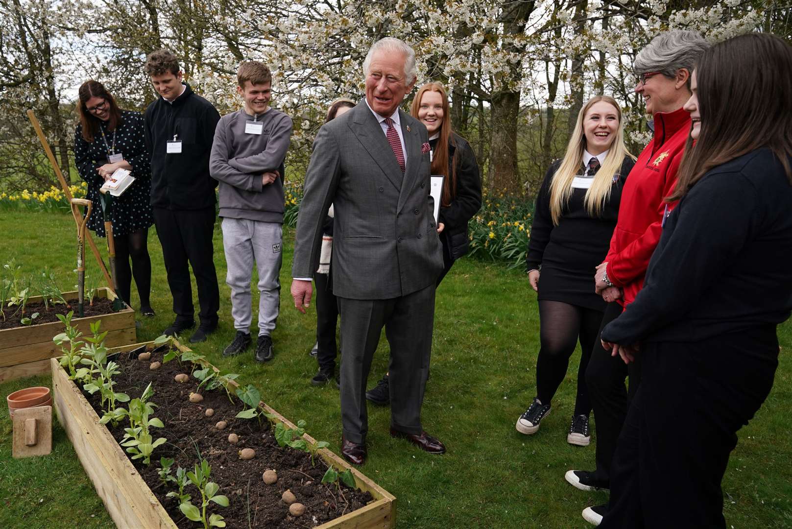 Charles meeting children from Robert Burns Academy, winners of the food waste solution challenge, as part of the Food For The Future education programme (Andrew Milligan/PA)