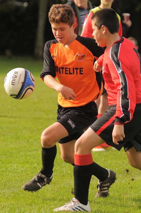 Rainham Kenilworth, in red, take on Woodcoombe Youth in Under-15 Division 1. Picture: Steve Crispe