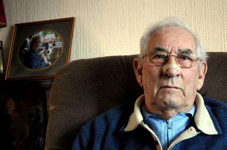 Fraud victim James Campbell – in the background is a picture of his wife Lucille who died three years ago