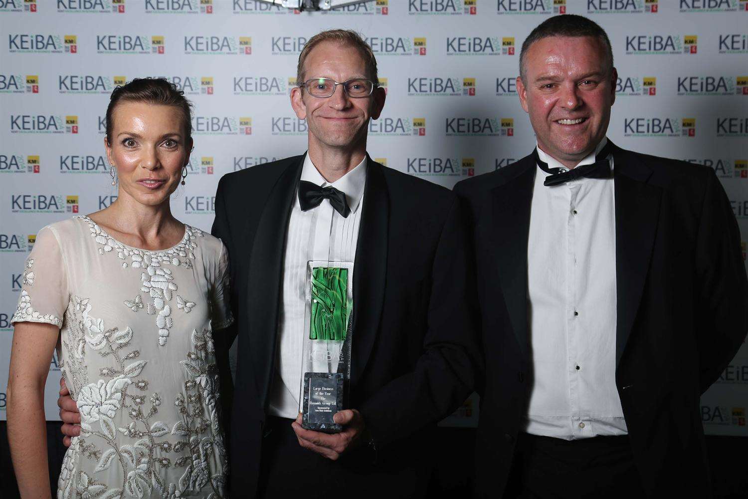 Reynolds Group Emma Reynolds and Jason Hall pick up the Large Business of the Year award at the KEiBAs with sponsor Jon Cooper of Aon Risk Solutions, right