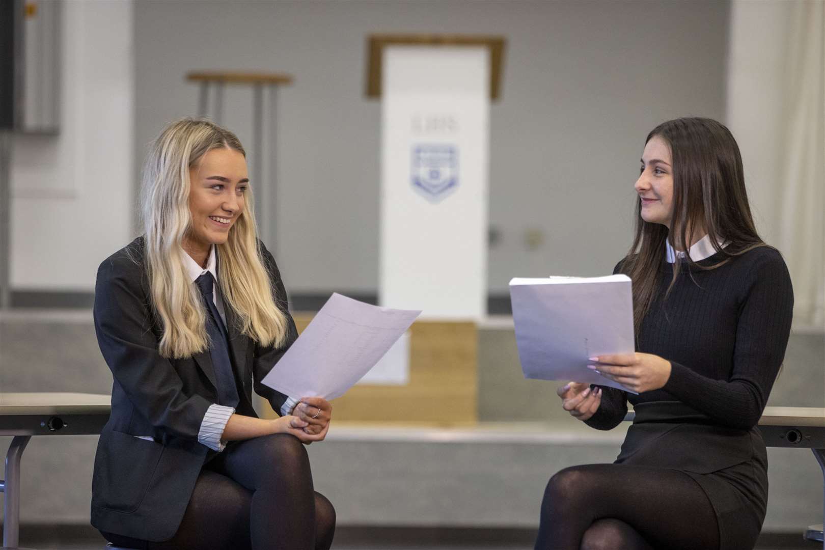Brooke Adam (left) and Millie O’Neil with their exam results at Linwood High (Jeff Holmes/PA)