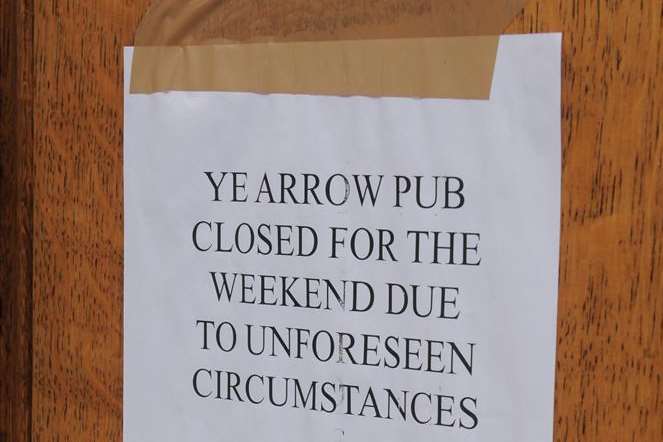 The sign on the pub door