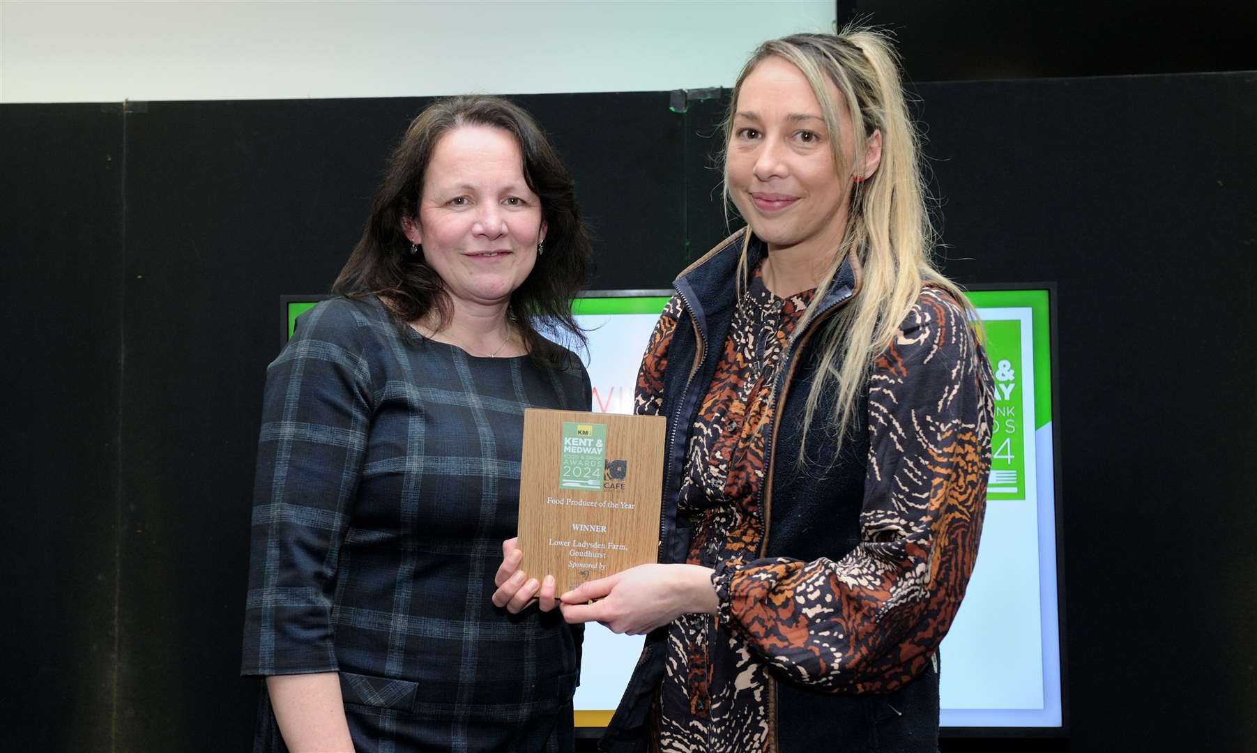 Angela Cole (left) of Shepherd Neame presented Suzie Kember (right) with the award for Lower Ladysden Farm, a family-run farm where visitors can pick their own fresh fruit and vegetables throughout the season, including pumpkins in the autumn. Picture: Simon Hildrew