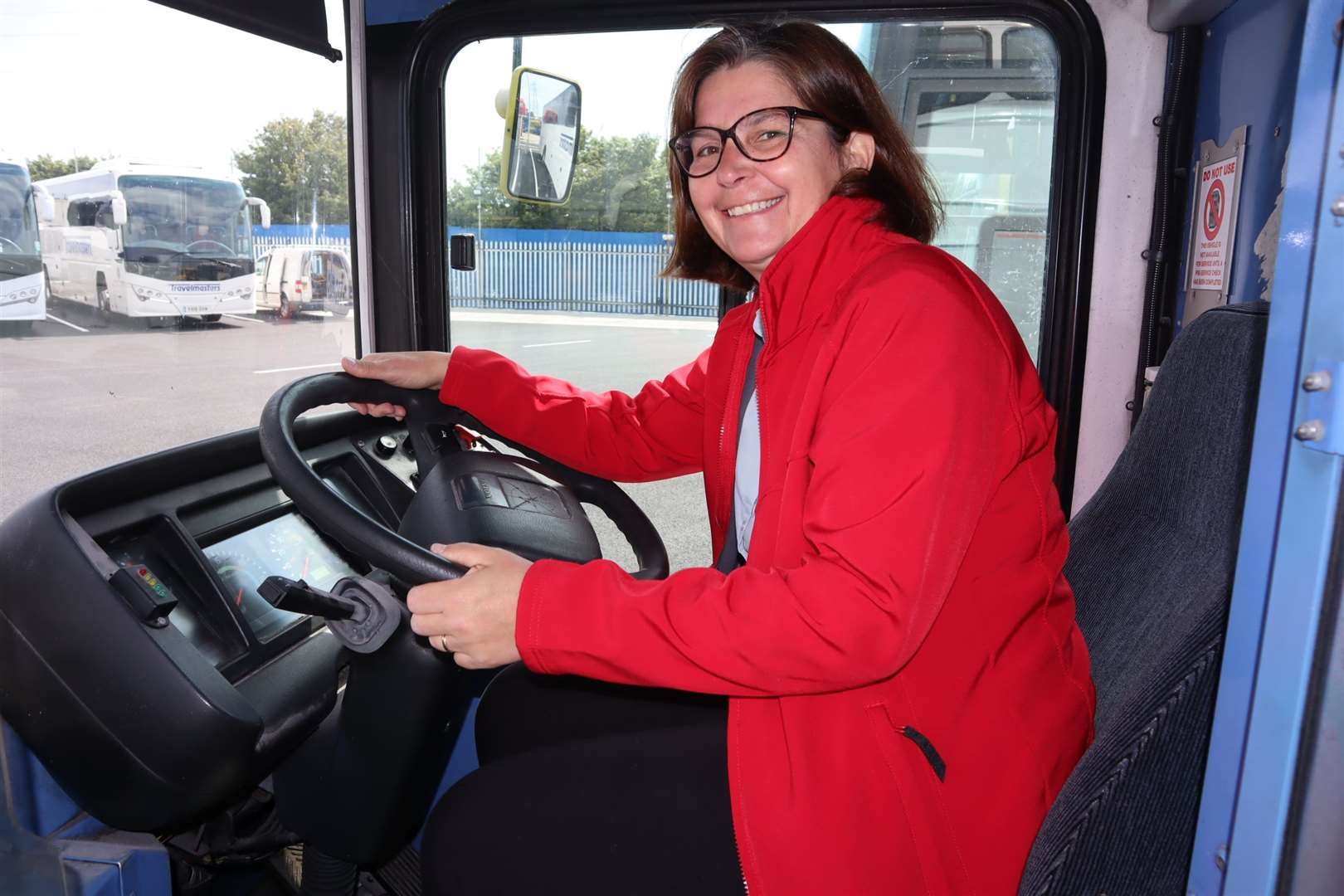 Major Lynne Clifton of Sheerness Salvation Army at the wheel of Sheppey Community Development Forum's community supermarket bus donated by Tim Lambkin of Travelmasters