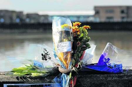 Flowers mark spot of river tragedy