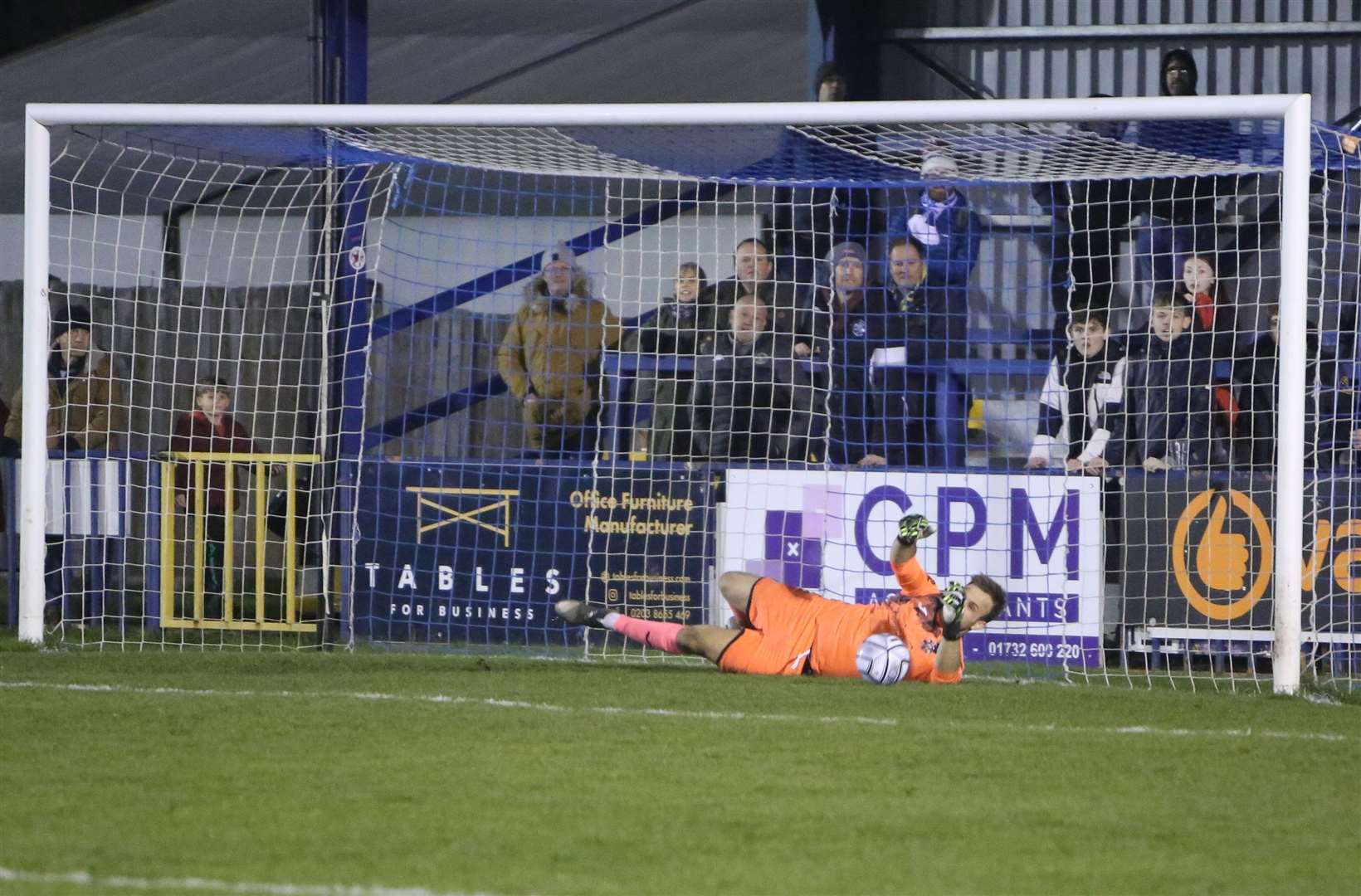Jonny Henly saves from the spot during Tonbridge's shoot-out victory over King's Lynn Picture: Dave Couldridge