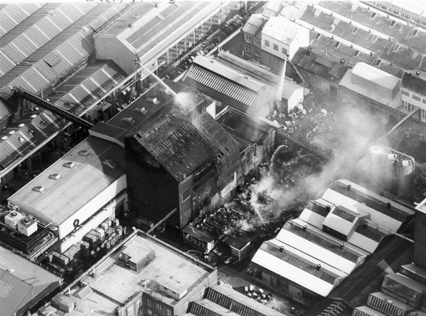 Fire crews extinguishing a blaze at the AEI factory in Northfleet in July, 1986. Picture: Dominic Maniere