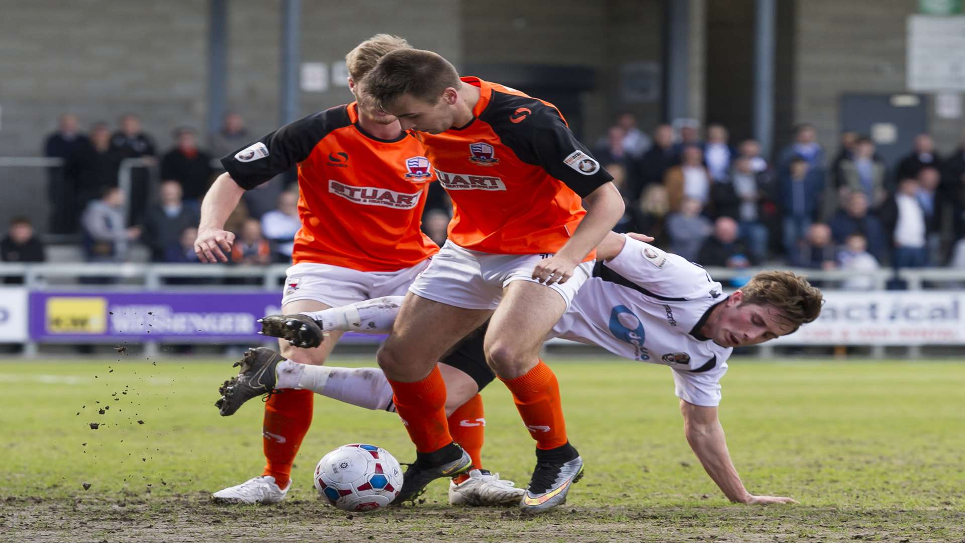 Dartford's Lee Noble takes on two Nuneaton players Picture: Andy Payton