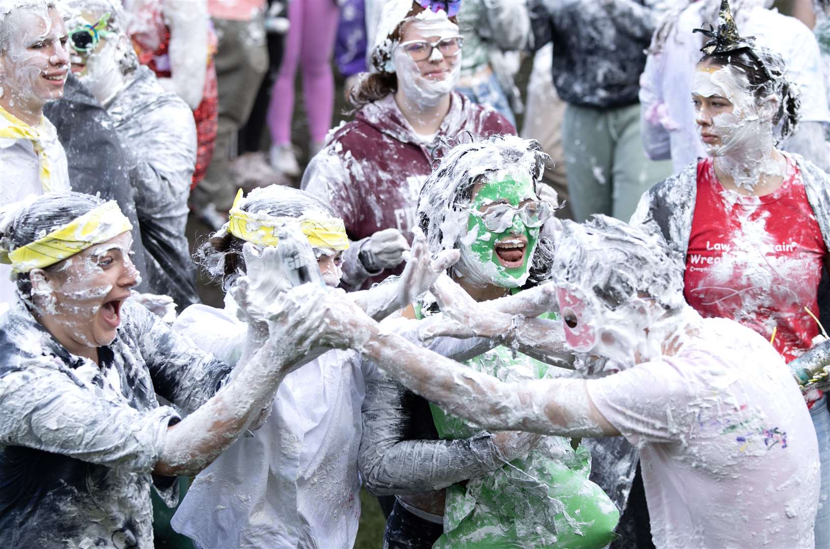 Students take part in the traditional Raisin Monday foam fight on St Salvator’s Lower College Lawn at the University of St Andrews in Fife in October (PA)