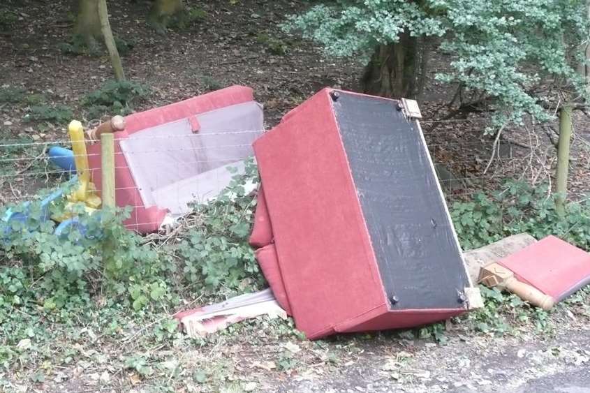 An old bed, settee and other items dumped at Military Hill, Dover.