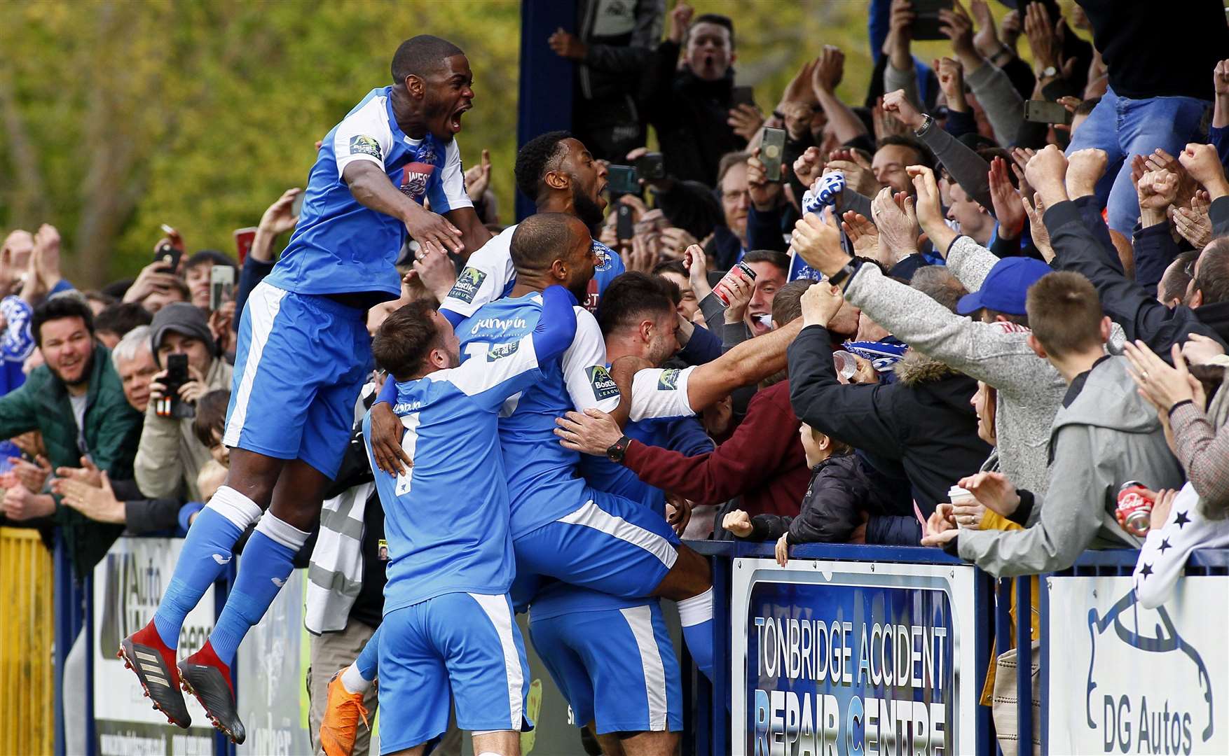 Tonbridge Angels players and fans celebrate successful times at Longmead Stadium. Picture: Sean Aidan