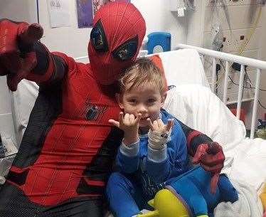 Young George gets a special visit from Medway Spidey in hospital and the two played games